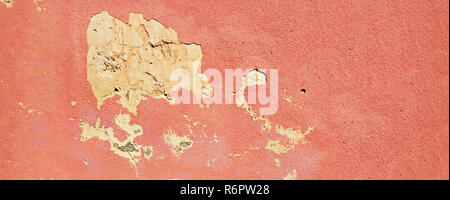 Old cracked terracotta wall. Painted texture background. Banner. Stock Photo