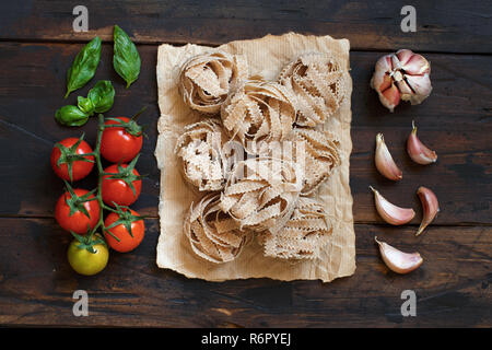Whole wheat pasta tagliatelle, vegetables and herbs Stock Photo