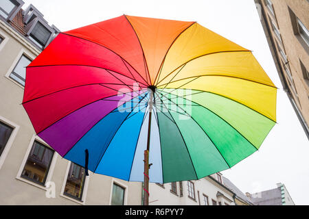 Open rainbow coloured umbrella Stock Photo