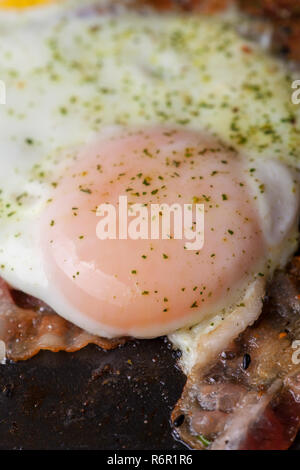 eggs with bacon in a pan Stock Photo
