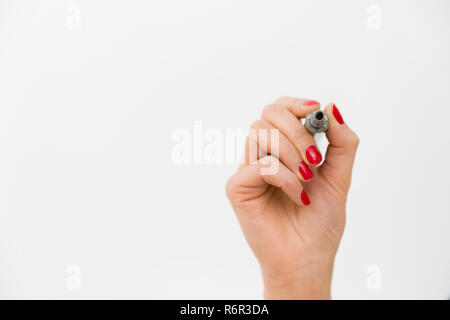 Hand with a marker isolated over white Stock Photo