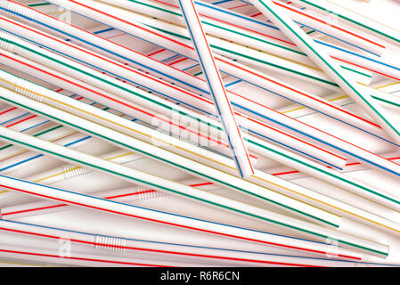 Drinking straw colorful plastic tubes over white background Stock Photo