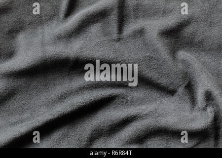 Texture of gray fleece, soft napped insulating fabric made from polyester, wavy pattern Stock Photo