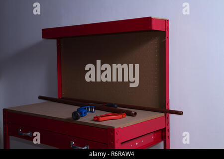 plumber at work on his workbench to fit pipes Stock Photo