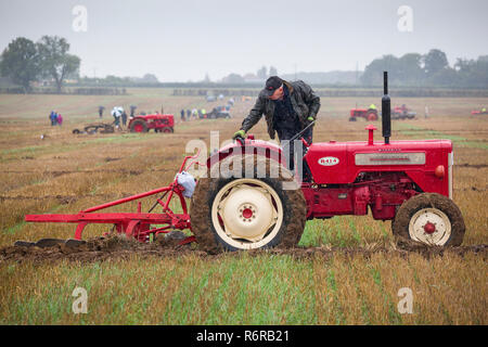 Vintage tractors compete in the rain at the annual ploughing match for Henley Agricultural Show, near Henley-on-Thames, Oxfordshire Stock Photo