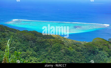 Blue tropical lagoon and green forest seen from the heights of Huahine island in French Polynesia, south Pacific ocean Stock Photo