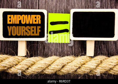 Ttext showing Empower Yourself. Business concept for Positive Motivation Advice For Personal Development written on Blackboard Equation space for your text on the wooden background. Stock Photo