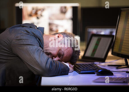 Tired Businessman Sleeping In Office Stock Photo