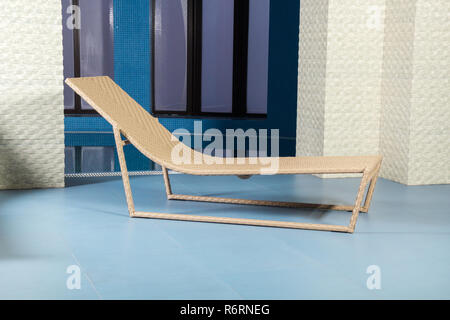 Chaise longue by pool Stock Photo