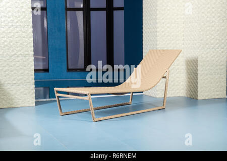 Chaise longue by pool Stock Photo