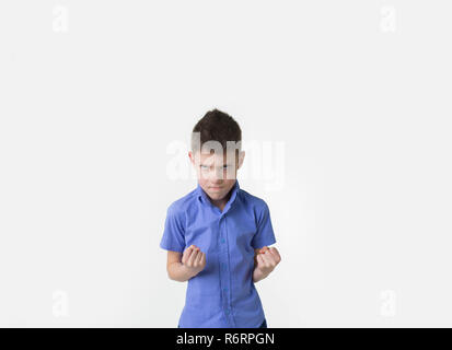 angry young boy with fists clenched isolated on white Stock Photo