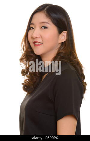 Portrait of young happy Asian businesswoman smiling Stock Photo