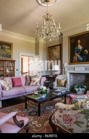 18th century Goodnestone estate Portrait of Fanny Fowler above fireplace in drawing room with pink sofa in 18th century Goodnestone mansion Stock Photo