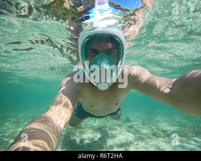 Young man snorkeling in Thailand Stock Photo