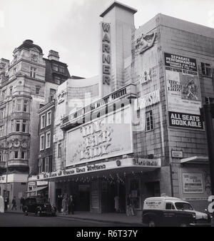 1964, the film 'My fair Lady' by Warner Bros., staring Audrey Hepburn and Rex Harrison being shown at the Warner Cinema, Leicester Court, Westminster, London, WC2. The american musical film was adapted from the famous Lerner and Loewe stage musical which itself was based on the 1913 stage play 'Pygmalion' by George Bernard Shaw. It was the estimated to be the most expensive film shot in the US up to that time, with a budget of $17 million. Stock Photo