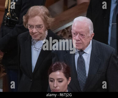Washington, United States Of America. 05th Dec, 2018. Former United States President Jimmy Carter, right, and former first lady Rosalynn Carter, left, depart following the National funeral service in honor of the late former US President George H.W. Bush at the Washington National Cathedral in Washington, DC on Wednesday, December 5, 2018. Credit: Ron Sachs/CNP (RESTRICTION: NO New York or New Jersey Newspapers or newspapers within a 75 mile radius of New York City) | usage worldwide Credit: dpa/Alamy Live News Stock Photo