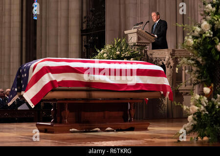 Former President George W. Bush, delivers a eulogy as casket of his father, former President George H.W. Bush lies in repose during the State Funeral at the National Cathedral December 5, 2018 in Washington, DC. Bush, the 41st President, died in his Houston home at age 94 and will be buried at his presidential library at Texas A&M University. Stock Photo