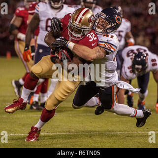 Chicago Bears free safety Chris Conte (R) is tacked by Minnesota Vikings  fullback Jerome Felton after returning an interception 35 yards during the  second quarter at Soldier Field on November 25, 2012