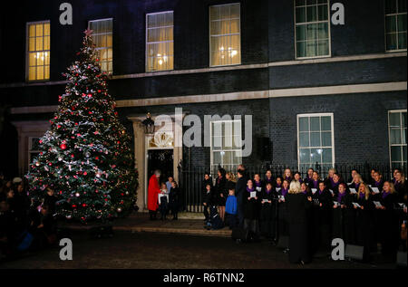 London, UK. 6th Dec, 2018. British Prime Minister Theresa May attends the switch-on of the Christmas tree lights outside 10 Downing Street with three children in London, Britain on Dec. 6, 2018. Credit: Han Yan/Xinhua/Alamy Live News Stock Photo