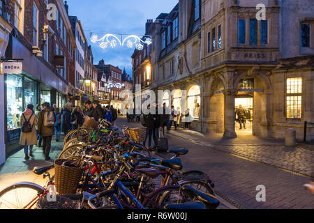 Shoppers in Trinity Street, Cambridge at dusk. Stock Photo