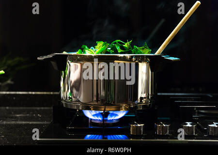 Spinach, The legend of the high iron content Stock Photo