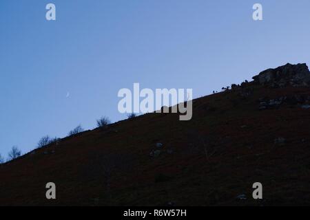 Silhouetted Valley Top Ridgeline at Twilight. Valley of the Rocks, Exmoor National Park, North Devon, UK. Stock Photo