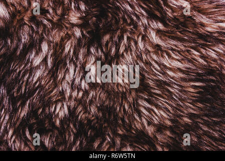 Brown dark warm faux fur texture. Animal wildlife concept Stock Photo
