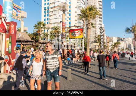 Benidorm, Costa Blanca, Spain. Drinkers enjoy high winter temperatures at the Tiki Beach bar on Levante beach has now been refurbished and reopened Stock Photo