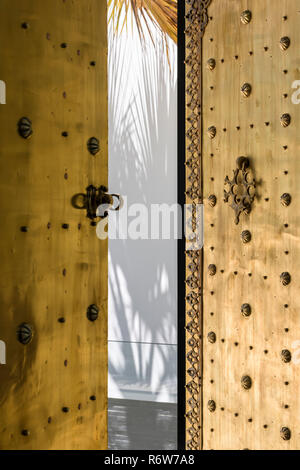 Decorative Moroccan brass door to modern villa in Quinta do Lago Stock Photo