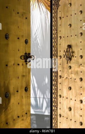 Decorative Moroccan brass door to modern villa in Quinta do Lago Stock Photo