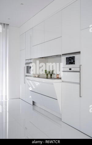 Recessed induction hob in minimalist kitchen of new build villa, Quinta do Lago Stock Photo