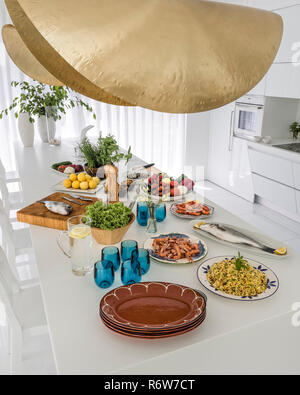 Mediterrannean lunch on kitchen island in new build villa, Quinta do Lago Stock Photo