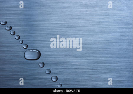 Water drops on brushed metal background Stock Photo