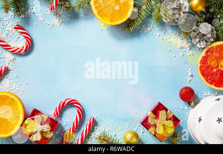 Christmas festive background with lantern and gifts on a blue stone background. Top view flat lay background. Copy space. Stock Photo