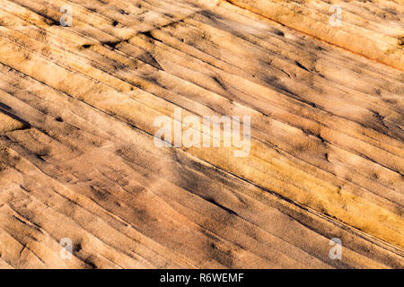 Rock surface near page Arizona could be “ripple marks”. They are formed by shallow water flowing over a bed of sand or other sediments, or by wind-dri Stock Photo