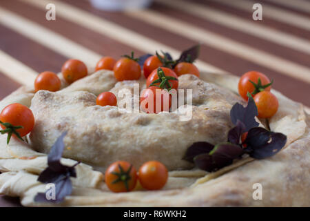 spiral filo pie burek with cherry tomatoes Stock Photo