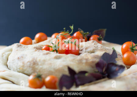 spiral filo pie burek with cherry tomatoes Stock Photo