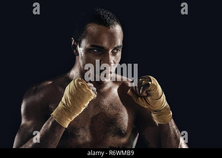 Afro man boxing and training over black background Stock Photo