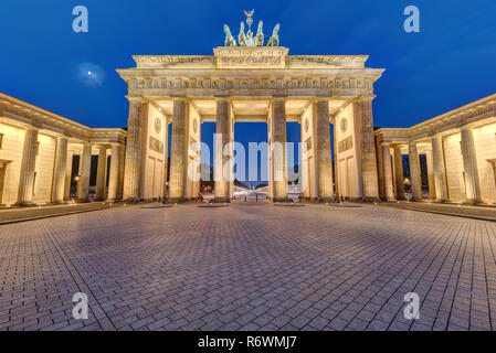 the illuminated brandenburg gate in berlin in the early morning Stock Photo