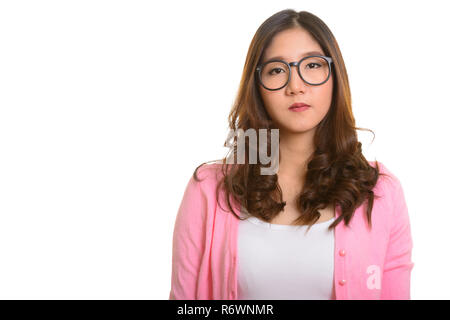 Portrait of young beautiful Asian woman wearing eyeglasses Stock Photo