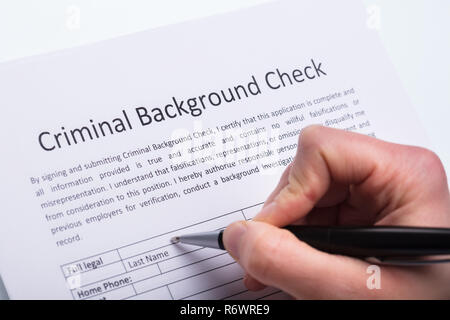 Person Filling Criminal Background Check Form Stock Photo