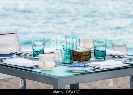 A Outdoor Set Table in the Sand by the Ocean at a Mexican Restaurant in Punta de Mita, Nayarit, Mexico Stock Photo