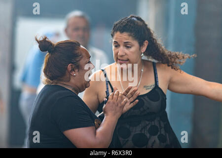 People victims of fire inside a workshop in Pudahuel neighborhood at Santiago de Chile City in between smoke a great misfortune Stock Photo