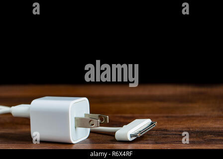 charger on a dark background on the surface Stock Photo