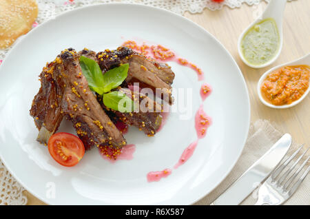 Pork ribs in mustard sauce Stock Photo