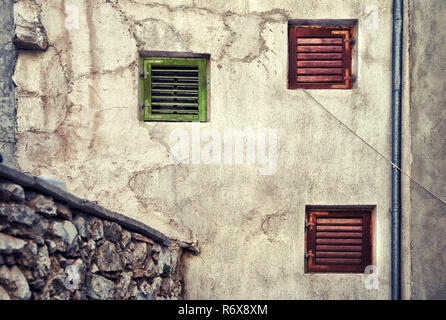 three shuttered window on the wall in Sibenik Croatia. Stock Photo