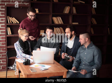 successful group of designers discussing a new advertising project Stock Photo