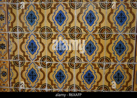 Lisbon / Portugal - May 2017: Portuguese traditional painted tin-glazed old ceramic tiles Azulejos with blue and brown ornament Stock Photo