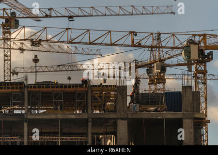Cranes working day and night on construction of the housing estate in ...