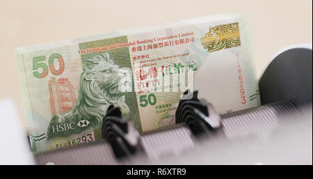 Hong Kong dollar on automatic counting machine Stock Photo